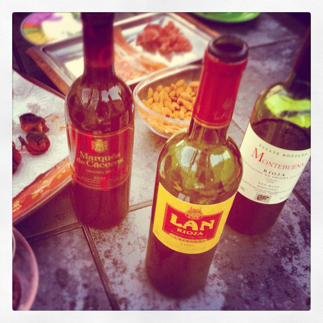 Riojas with bacon wrapped dates, salted cured meats and almonds